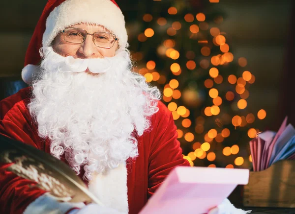 Santa Claus with Christmas letters — Stock Photo, Image