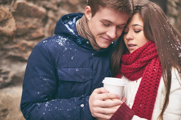 Couple warming up with coffee — Stock Photo, Image