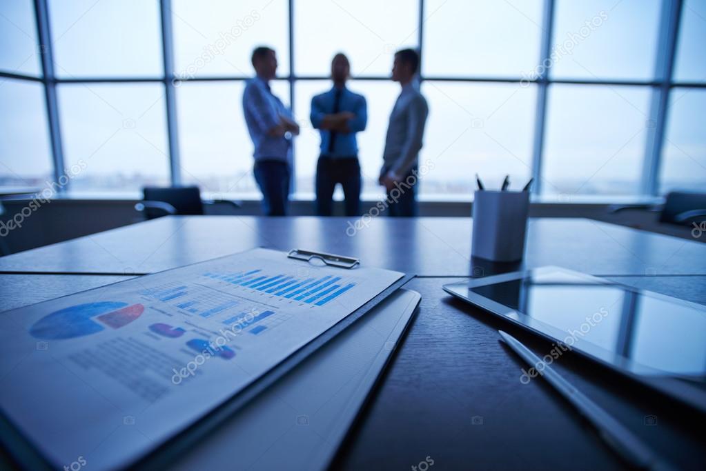 Documents and touchpad on table