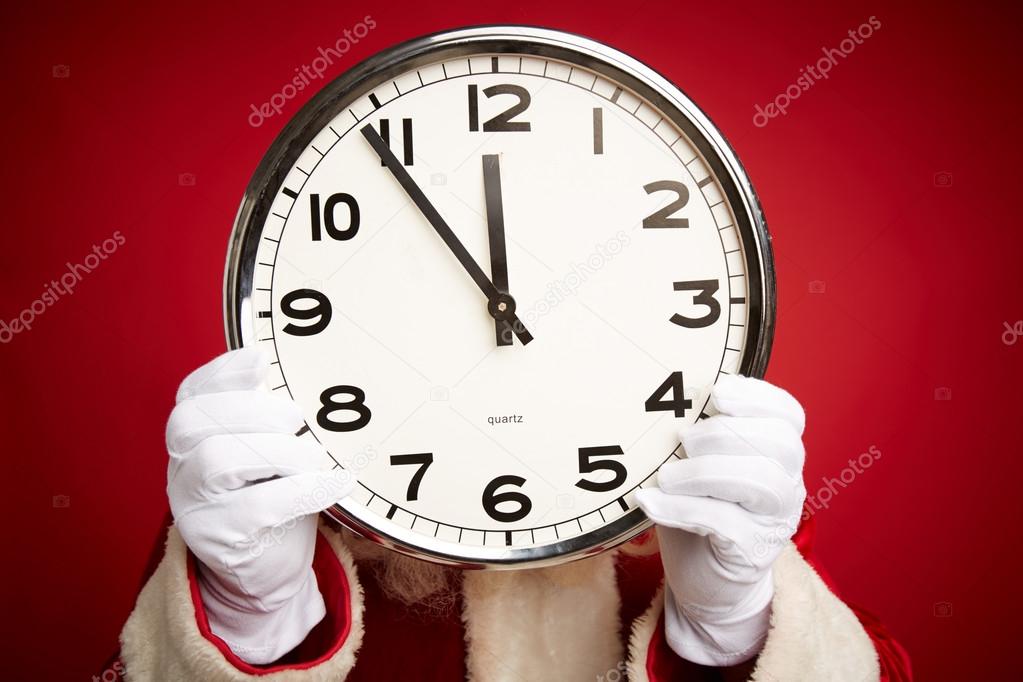 Santa Claus holding clock