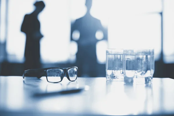 Eyeglasses and two glasses — Stock Photo, Image