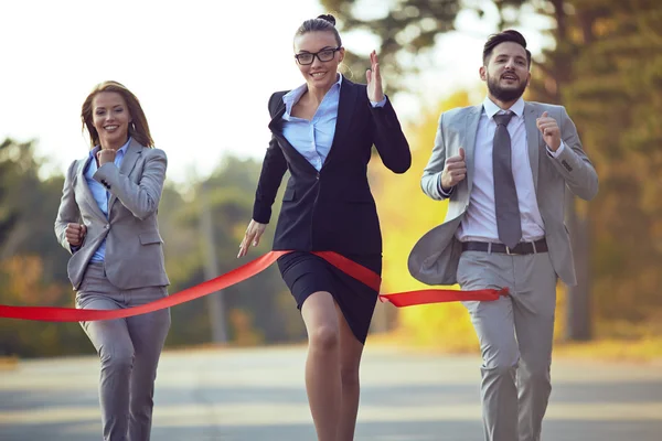 Businesswoman coming to finish — Stock Photo, Image