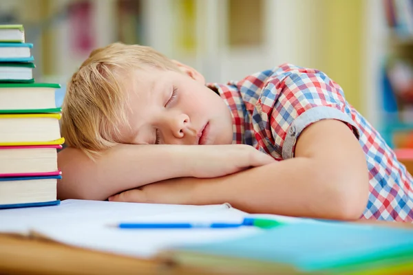 Schoolboy napping on desk — Stock Photo, Image