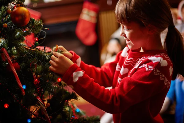 Girl decorating Christmas firtree — Stock Photo, Image