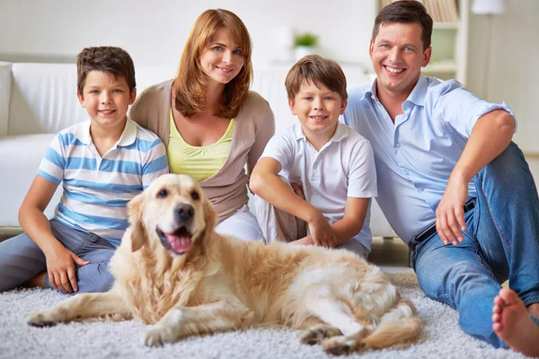 Family with Labrador dog — Stock Photo, Image