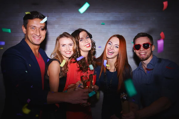 Friends toasting with champagne at party — Stock Photo, Image