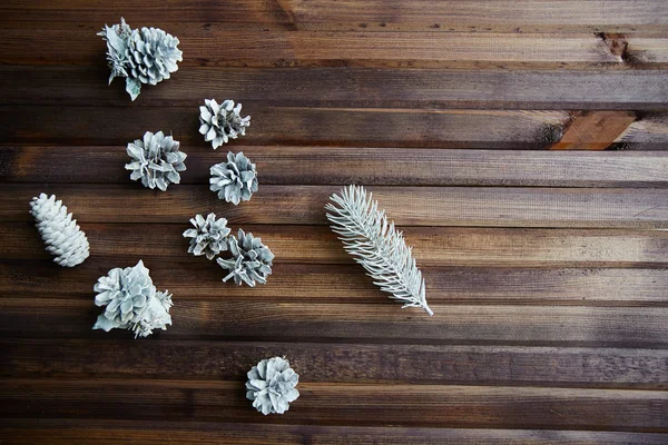 Frosty pinecones on wooden — Stock Photo, Image