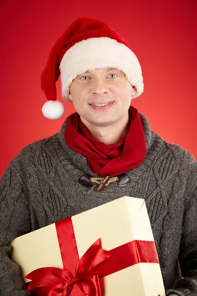 Santa man holding big giftbox — Stock Photo, Image