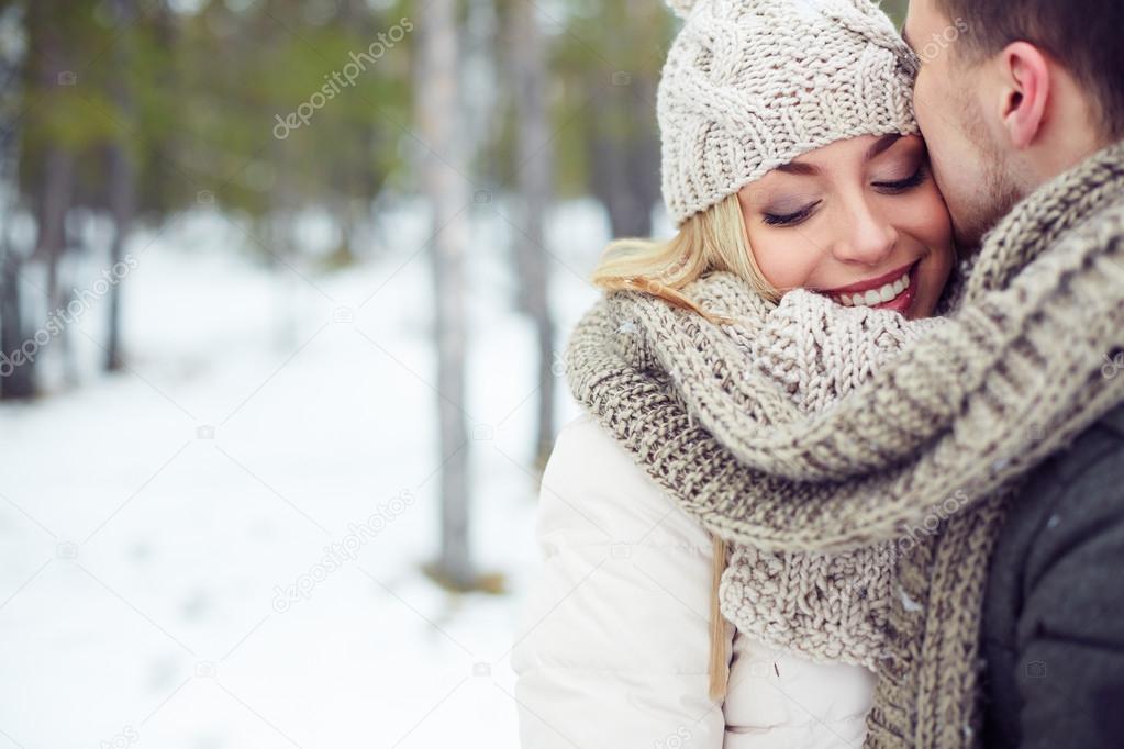 Woman with her boyfriend in winter park