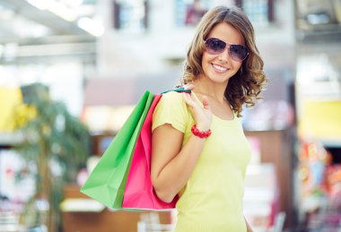 Woman with shopping bags clipart