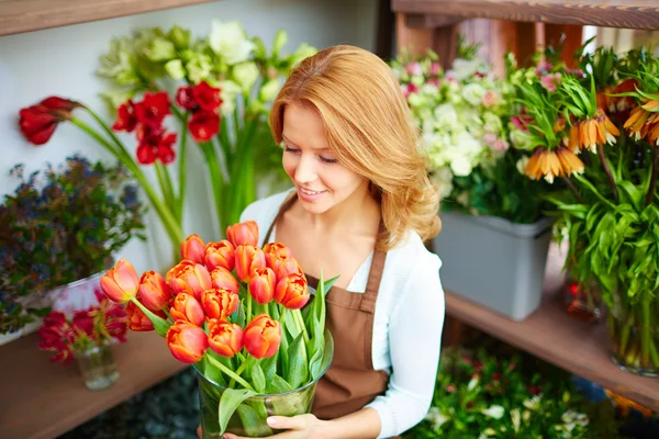 Happy florist with tulips
