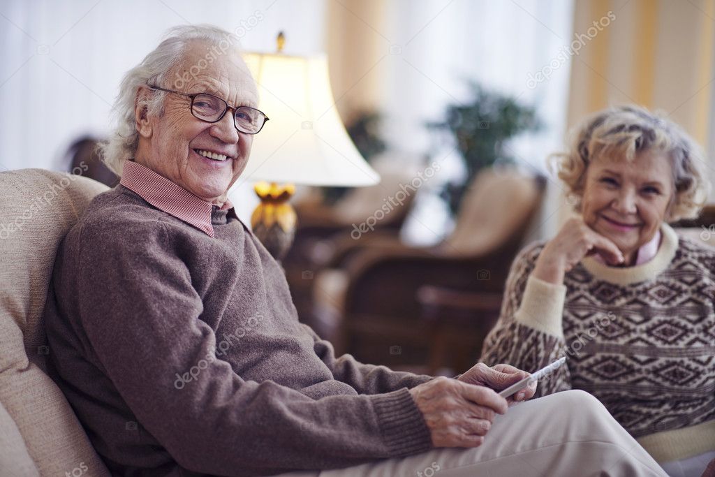 Senior man with wife holding tablet pc