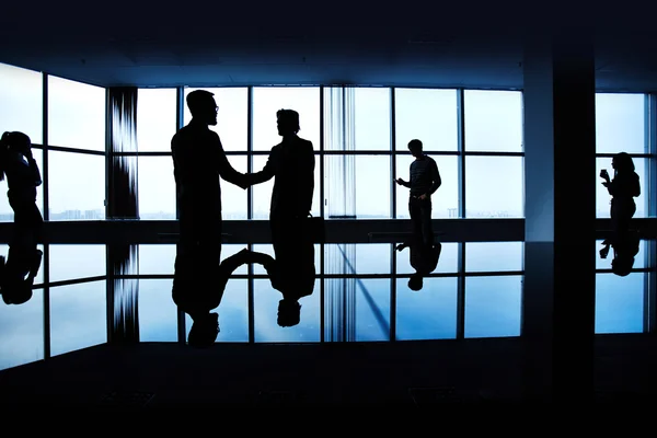 Silhouettes of business people — Stock Photo, Image