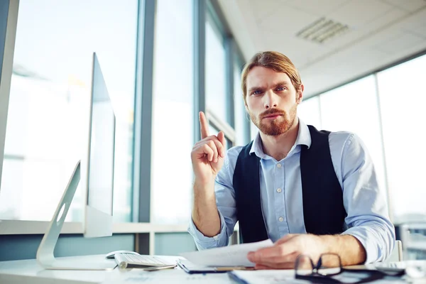 Businessman sitting at workplace — Stock Photo, Image