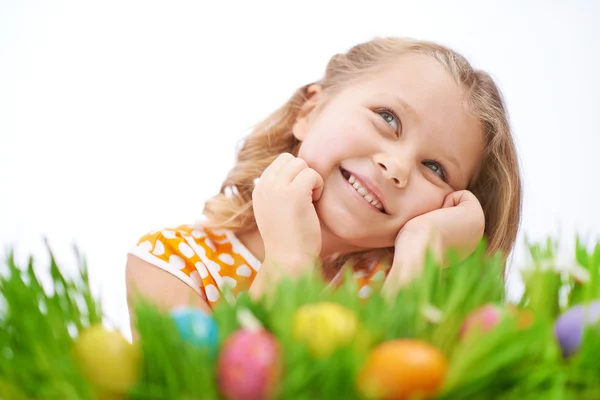 Girl on grass with Easter eggs — Stock Photo, Image