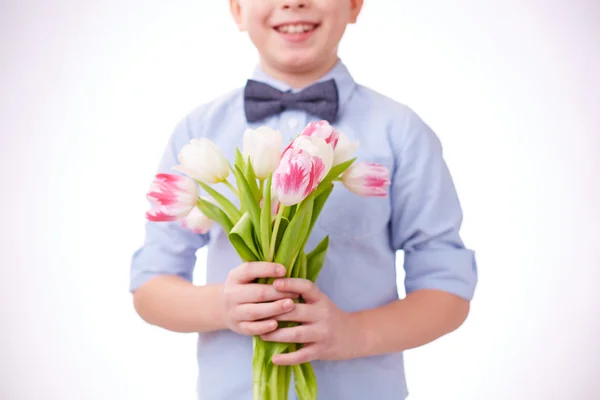 Tulips in hands of  child — Stock Photo, Image