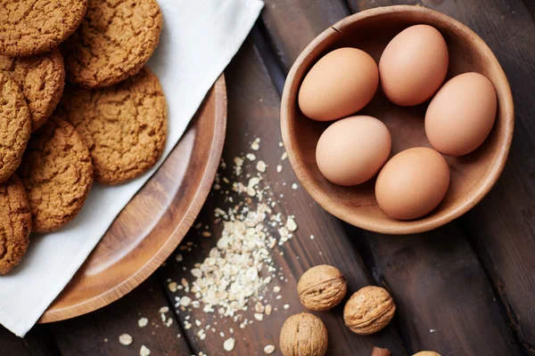 Biscuits, eggs and walnuts — Stock Photo, Image