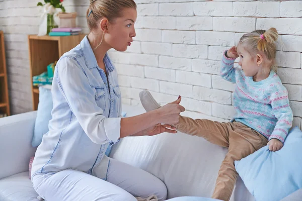 Woman taking care of daughter — Stock Photo, Image