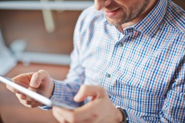 Adam holding touchpad