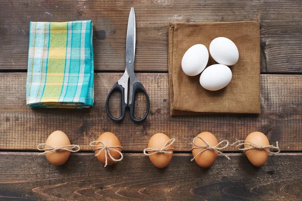 Eggs, scissors, linen and cotton napkins — Stock Photo, Image