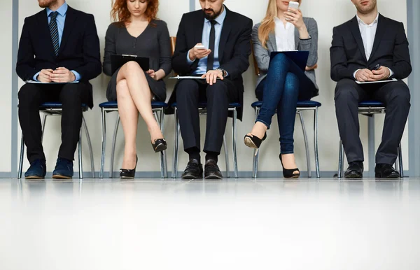 Line of people in turn for interview — Stock Photo, Image