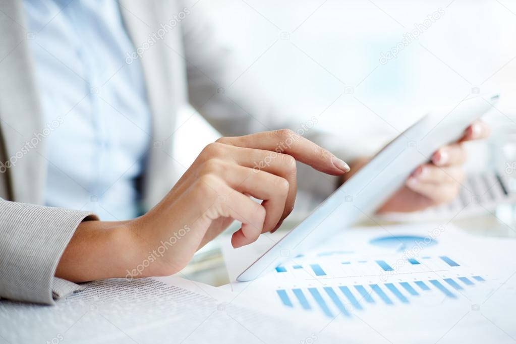 businesswoman showing something in touchpad