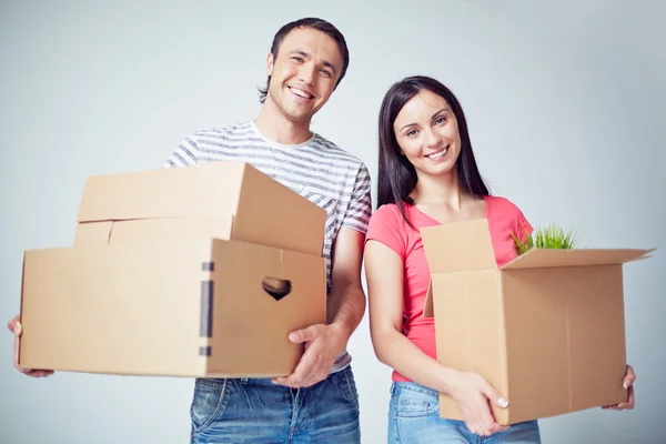 Happy settlers with boxes — Stock Photo, Image