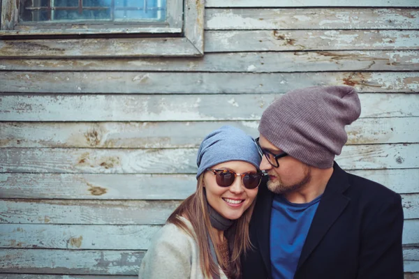 Young couple in sunglasses and hats — Stock Photo, Image