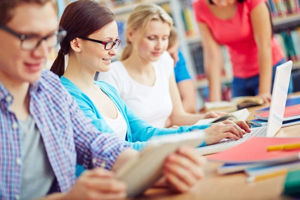 Student typing on laptop Stock Photo