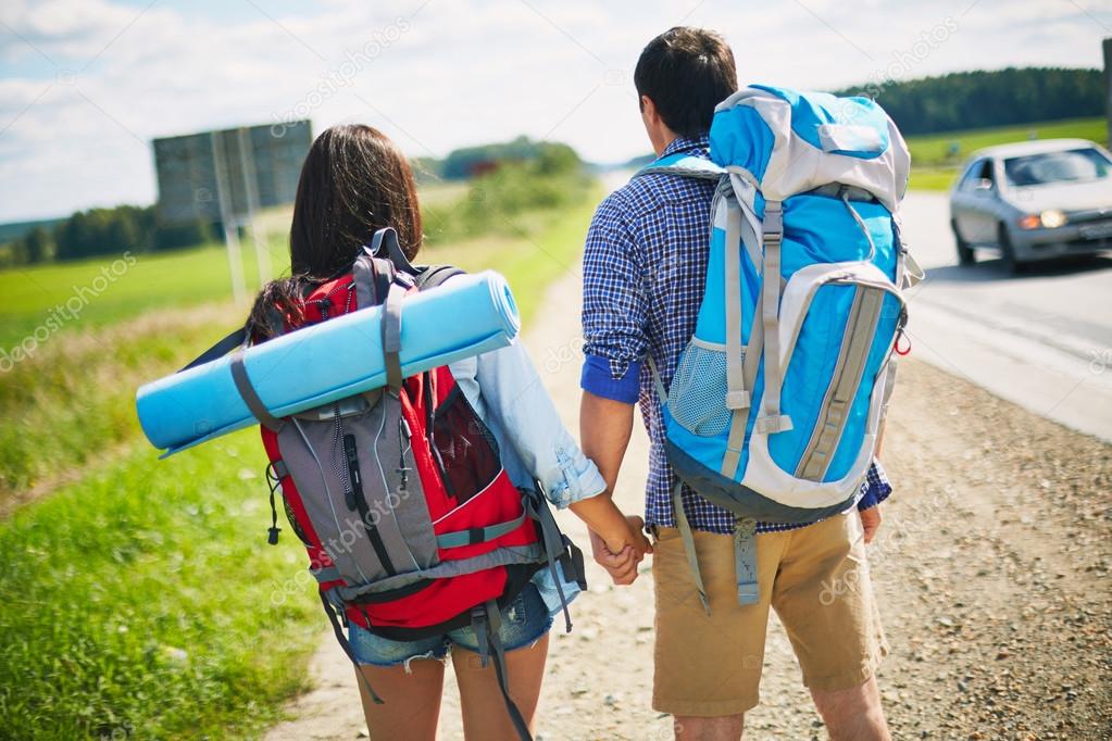 Couple of young hitch-hikers