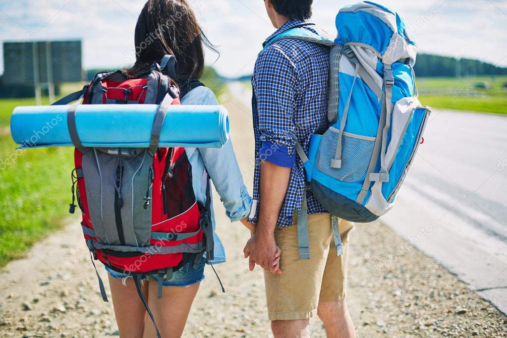 Couple of young hitch-hikers