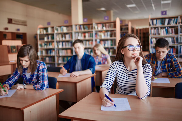 Pensive girl  in working environment at lesson