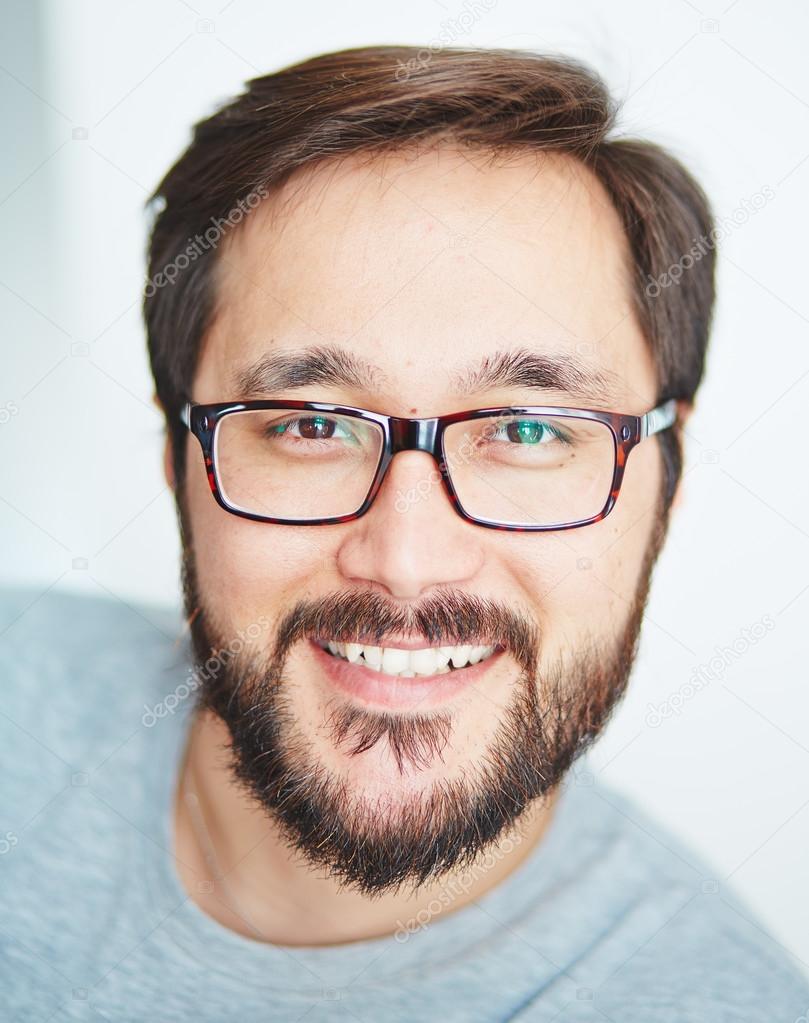 Asian man with beard in eyeglasses