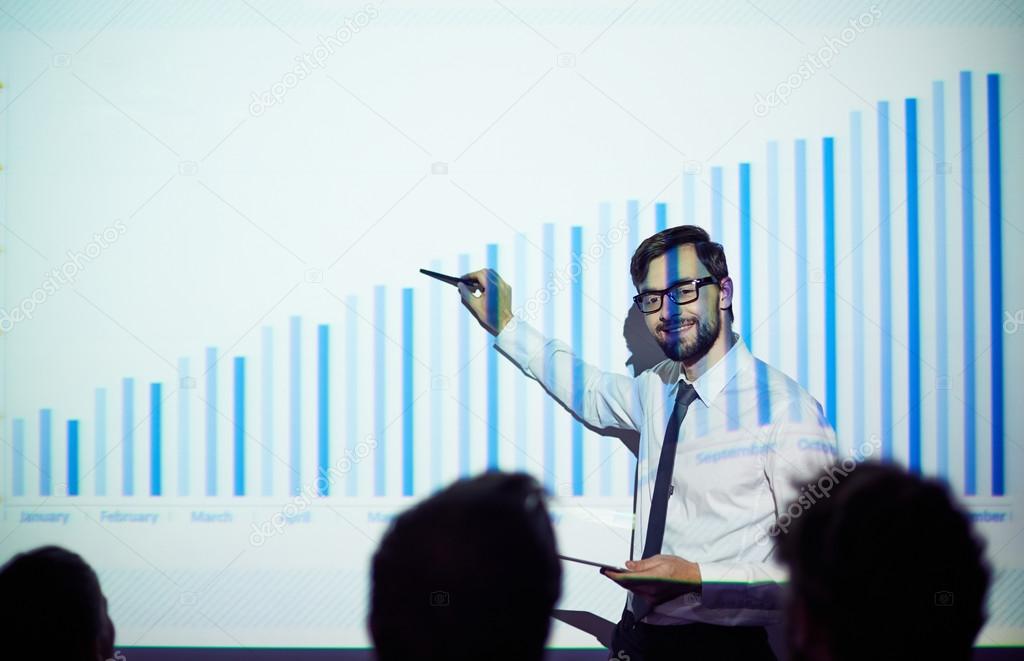 manager pointing at chart of financial progress