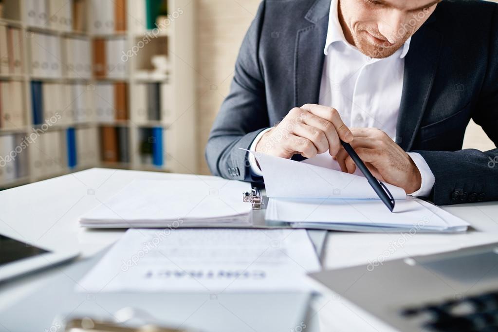 man reading documents - How Much Does It Cost To File Bankruptcy In Texas