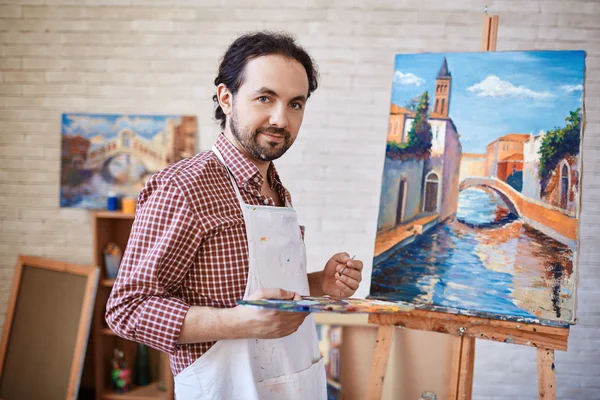 Young artist  with his painting — Stock Photo, Image