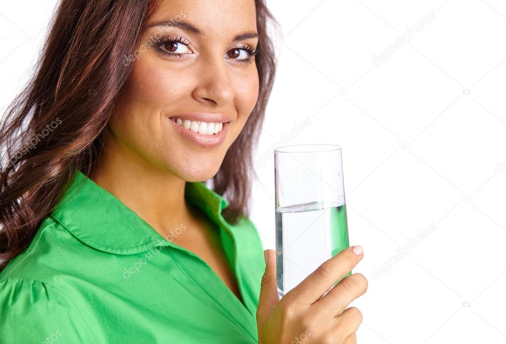 Woman holding glass of water Stock Photo by ©pressmaster 74089749