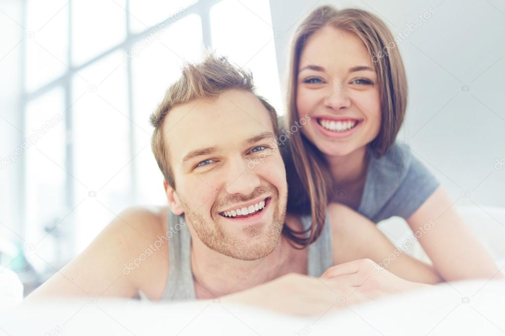 Young man and woman with smiles