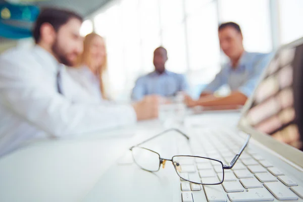 Eyeglasses on laptop keypad — Stock Photo, Image