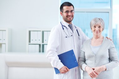 doctor with clipboard and senior patient clipart