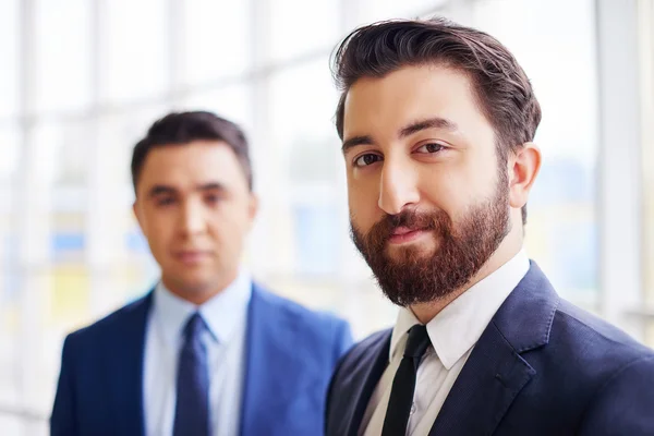 Confident businessman with colleague — Stock Photo, Image