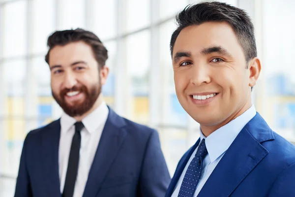 Young businessman with colleague — Stock Photo, Image