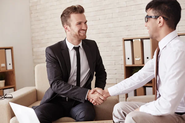 Business partners handshaking in office — Stock Photo, Image