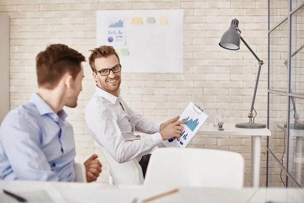 Businessman pointing at document with chart — Stock Photo, Image