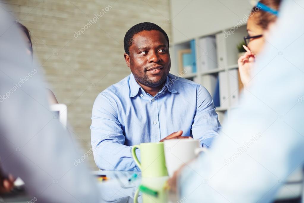 businessman looking at colleague at meeting