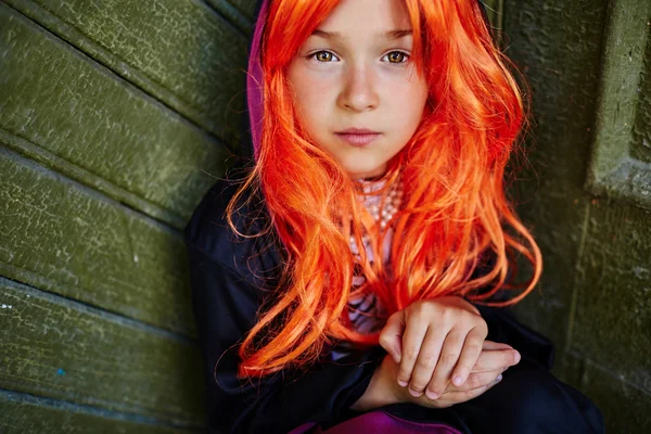 Little girl in orange wig — Stock Photo, Image
