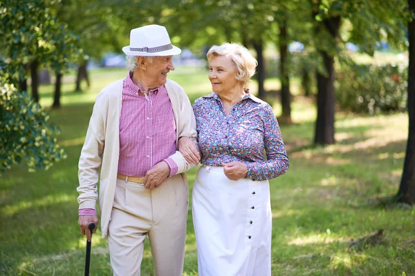 Senior couple interacting in park — Stock Photo, Image