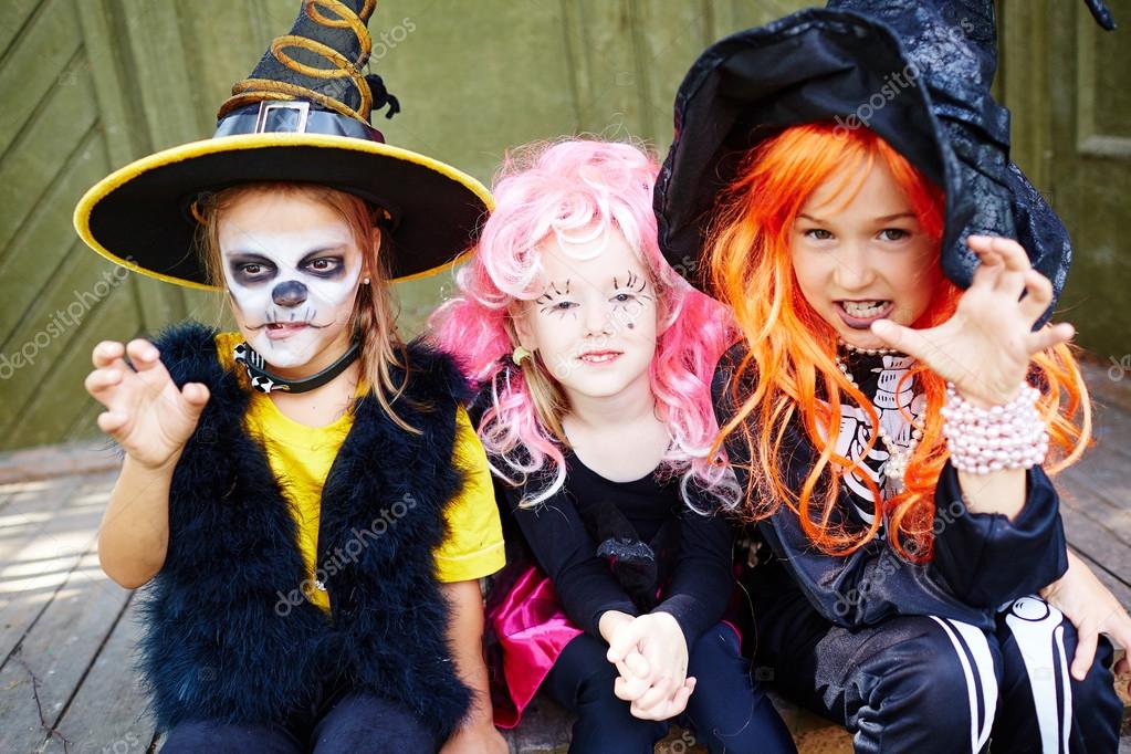 girls in halloween costumes stock photo