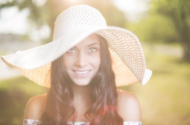 Elegant smiling woman in hat