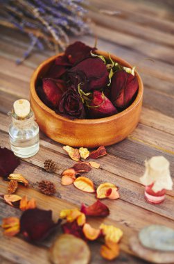Rose petals and perfume bottles